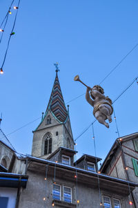 Low angle view of building against blue sky