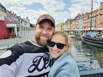 Selfie of the couple hugging in copenhagen famous landmark nyhavn