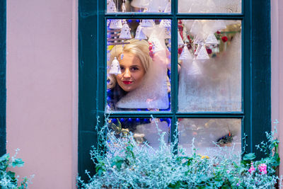 Portrait of woman by window