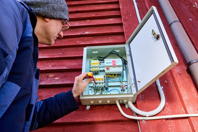 Rear view of man working in factory