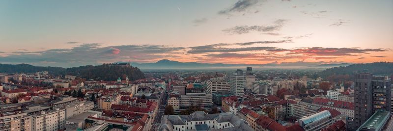 High angle shot of townscape against sky at sunset