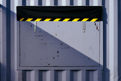 Grey container with closed metal window