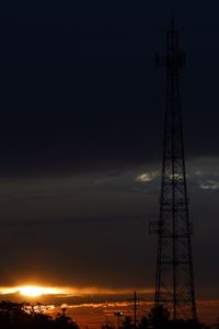 Low angle view of silhouette tower against sky during sunset