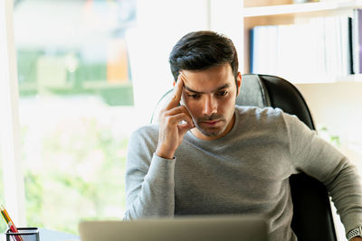 Portrait of man using mobile phone