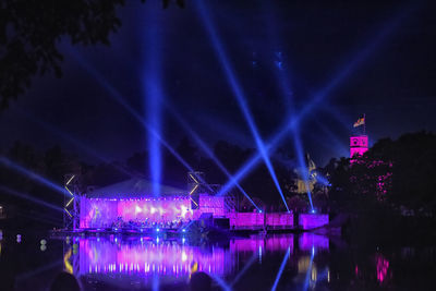 Illuminated buildings in city at night