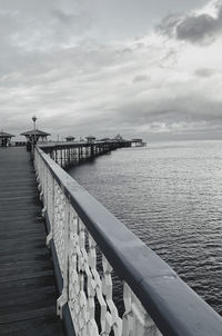 Pier over sea against sky