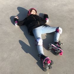 High angle view of girl with skating on park