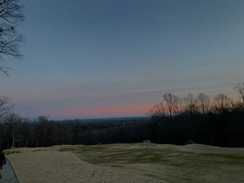 Scenic view of field against sky during sunset