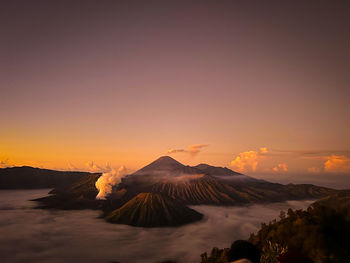 Scenic view of mountains against sky during sunset