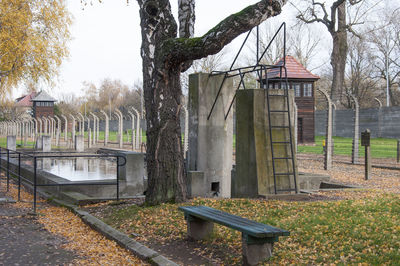 Gazebo by trees against sky