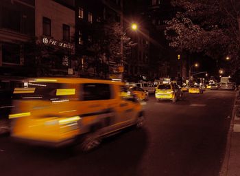 Traffic on city street at night