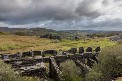 Scenic view of old landscape against sky