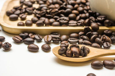 Close-up of roasted coffee beans on table