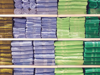 Full frame shot of towels arranged on shelf in store