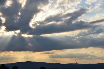 Sunbeams falling on landscape