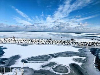 Scenic view of sea against sky during winter