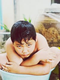 Close-up portrait of shirtless baby girl