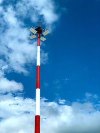 Low angle view of smoke stacks against sky