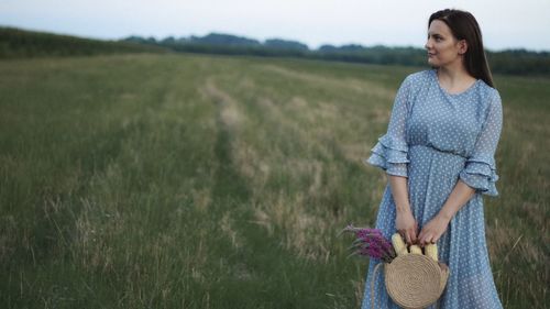 Woman standing on field