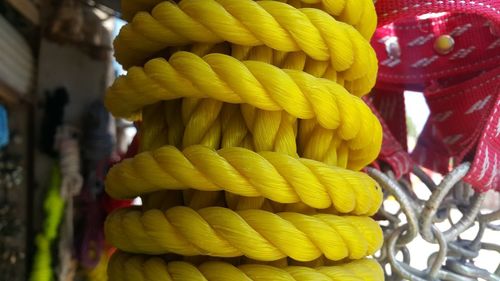 Close-up of multi colored tied up on rope