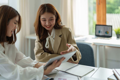 Young woman using laptop at home