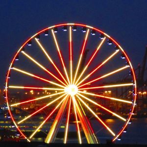 Low angle view of illuminated ferris wheel