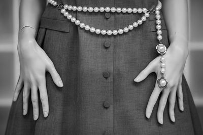 Midsection of woman with henna tattoo