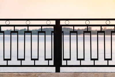 Close-up of railing against window