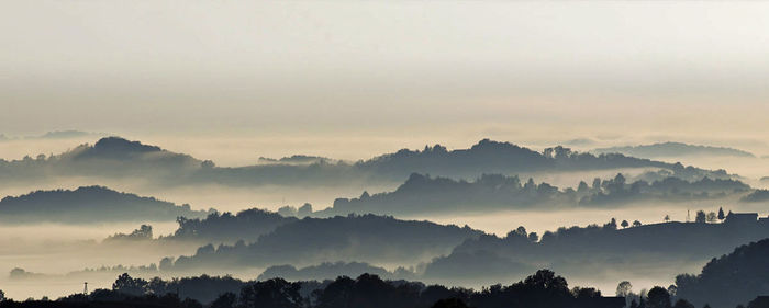 Panoramic view of landscape and mountains against sky at morning