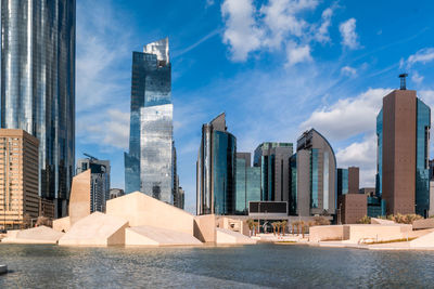 View of a cloudy day in a modern city, downtown abu dhabi landmarks, world trade center towers