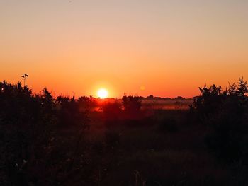 Scenic view of silhouette landscape against sky during sunset