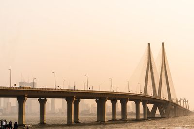 Bridge over river against clear sky