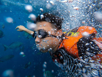 Close-up of man swimming in sea