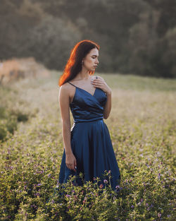 Young woman standing on field