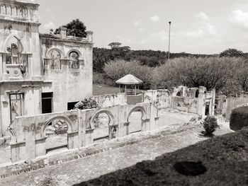 View of cemetery against built structure