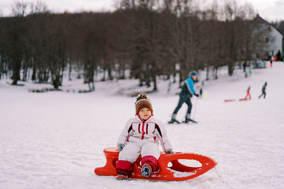 Man skiing on snow covered field