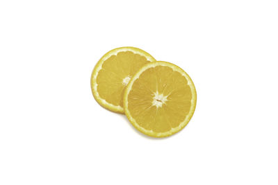 Close-up of lemon slice over white background