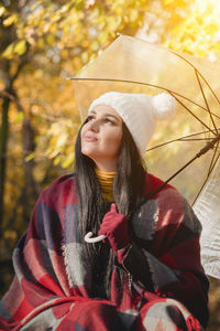 Young woman looking away outdoors