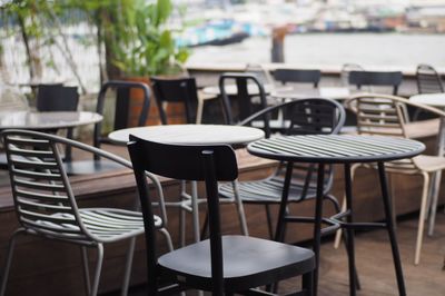 Empty chairs and table at cafe