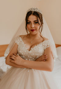 Portrait of young woman wearing wedding dress