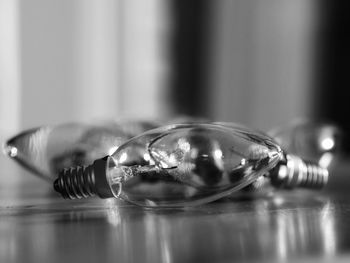 Close-up of light bulb on table