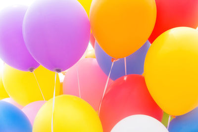 Low angle view of balloons against blue sky