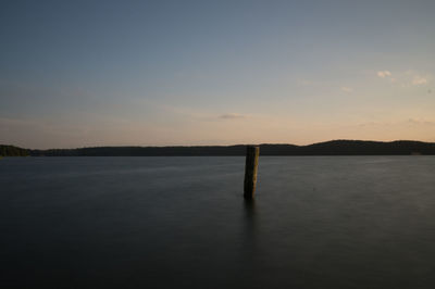 Scenic view of calm sea at sunset