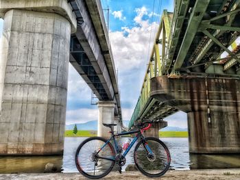 Low angle view of bicycle bridge against sky
