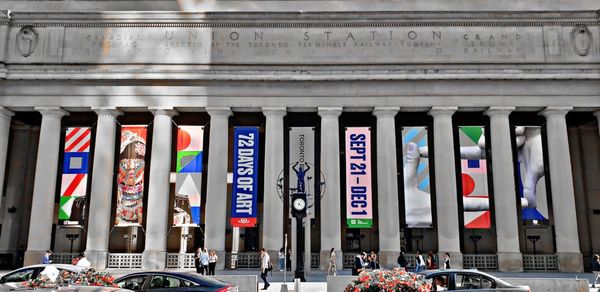 Multi colored flags in city