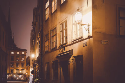 Low angle view of illuminated street at night