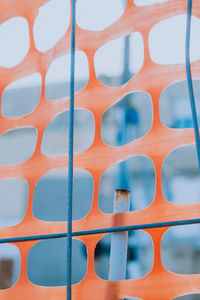 Full frame shot of plastic and metallic orange structure