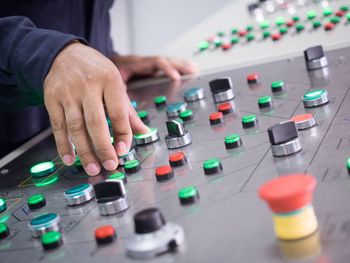 Close-up of hand using sound mixer