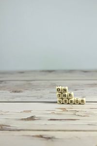 Close-up of toy on table against white background