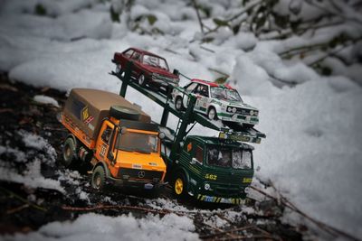 High angle view of cars on snow covered field